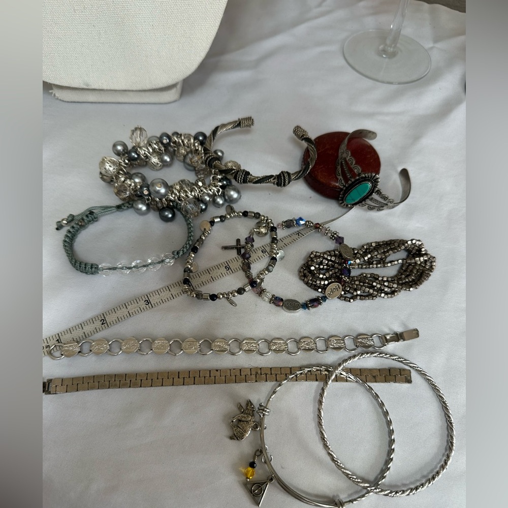 Large group of 11 silvertone bracelets